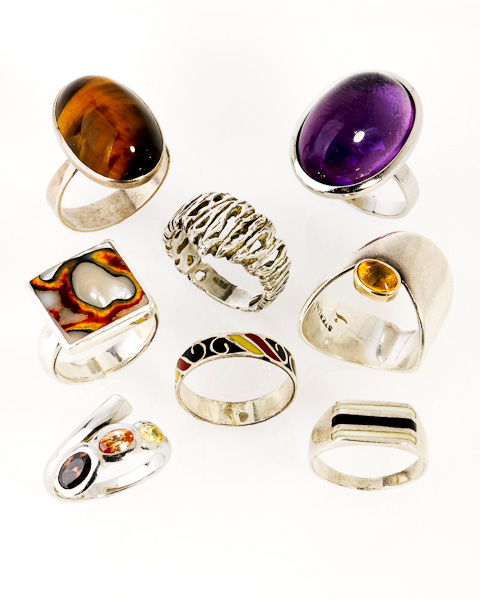 Eight assorted sterling silver set dress rings - Shapiro Auctioneers